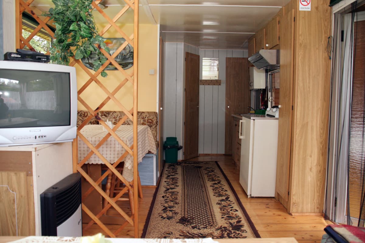 Living room with visible bedroom entrance